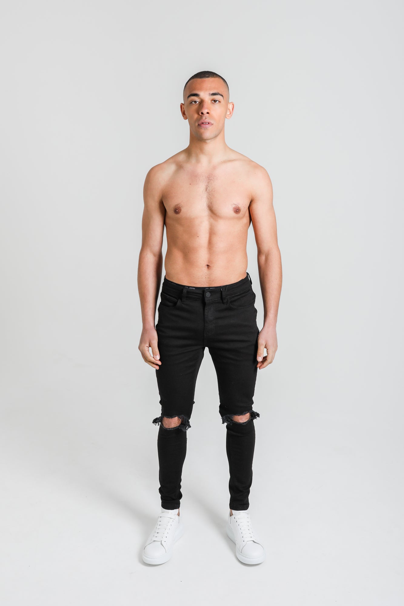 Black knee cut jeans deals